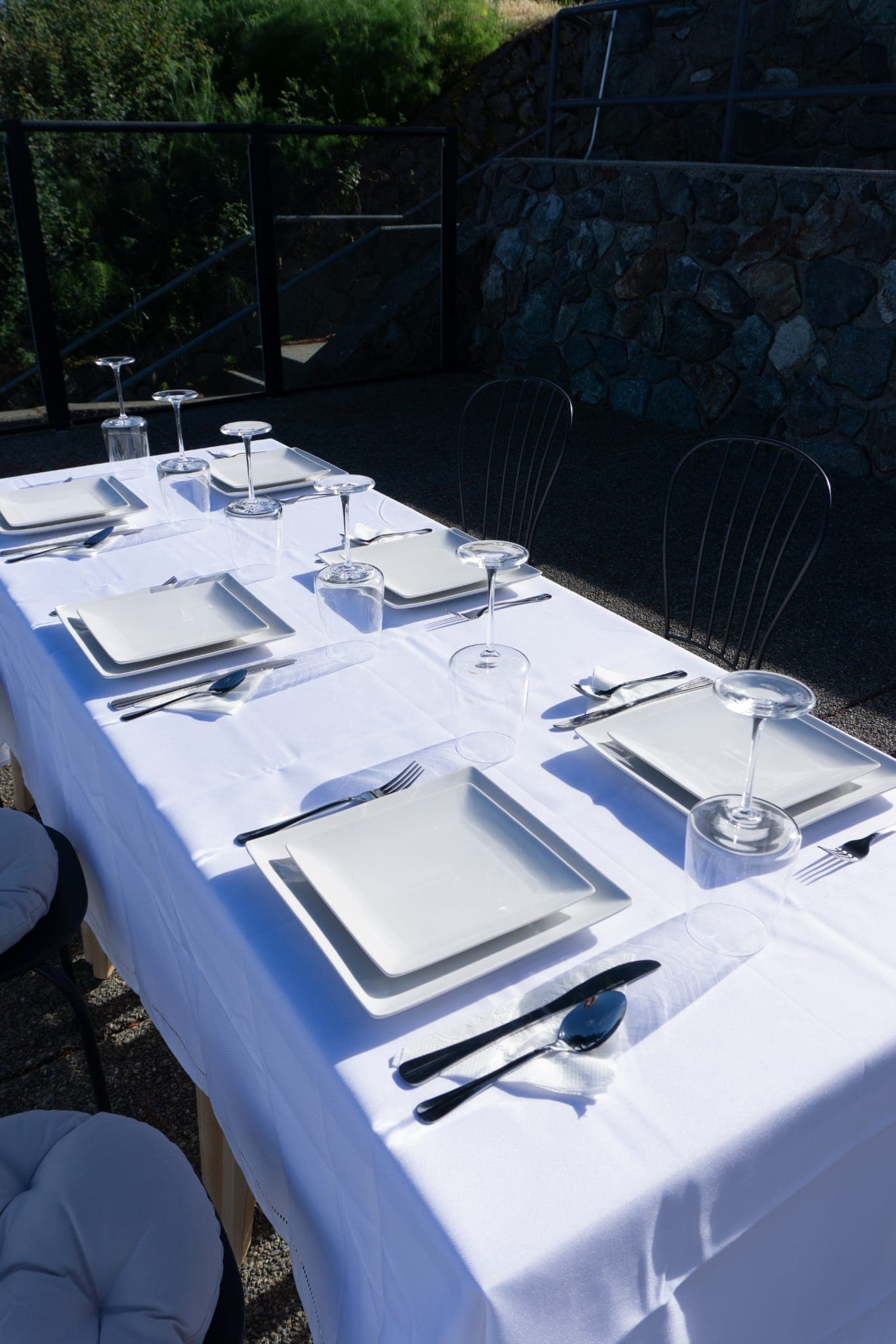 Formal outdoor dining table prepared for patio guests